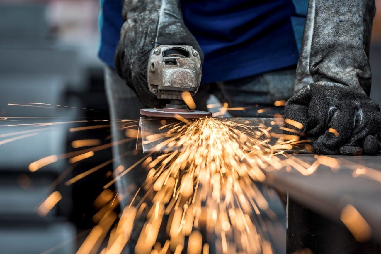 Image shows an industrial metal worker.