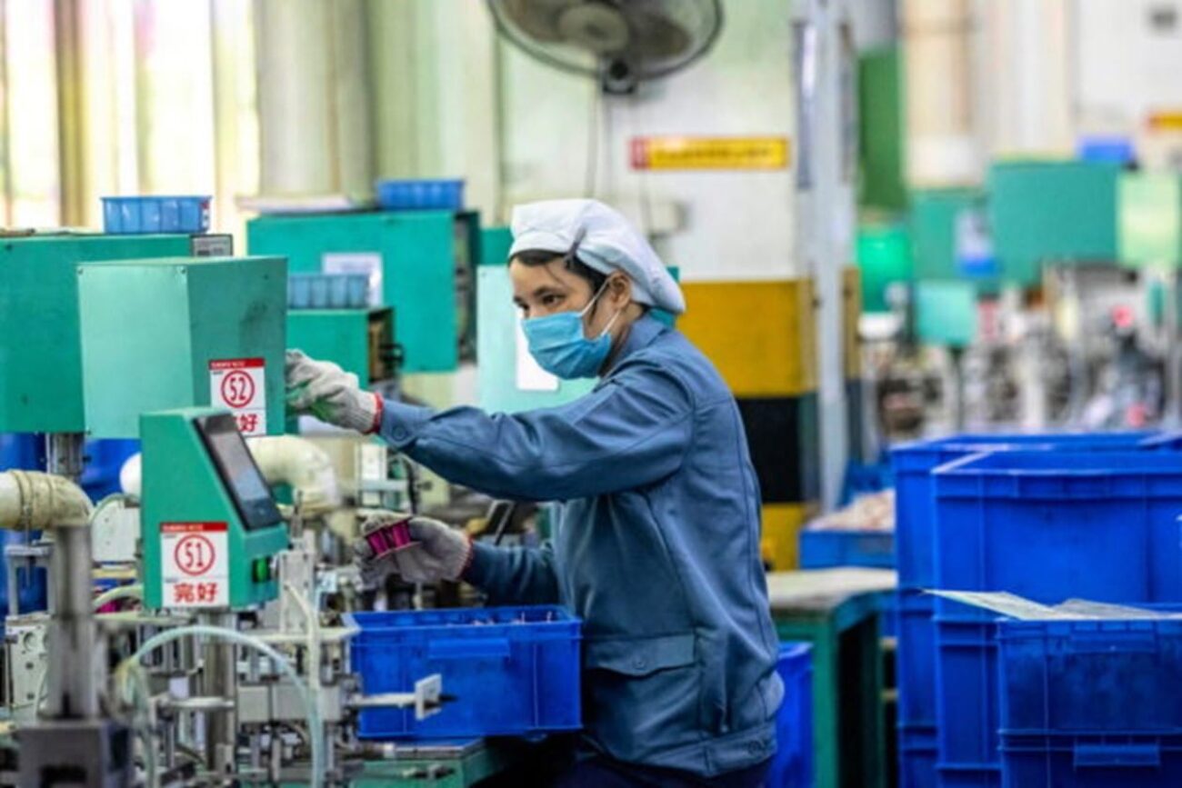 Image shows an image of Chinese factory worker.