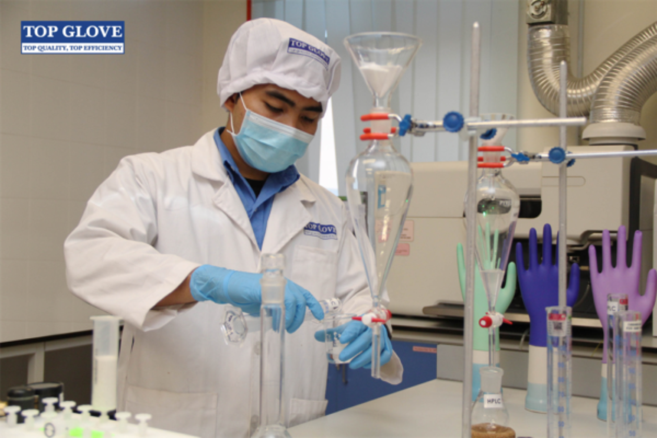 Image shows a top glove worker in a lab.